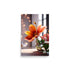 A vibrant orange flower blooming from a clear glass vase.