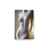 A porcelain sculpture of a female body in an artistic elegant pose.
