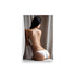 An alluring figurative art of a woman in bikini bottoms sitting with a pose slightly bent over, looking back.