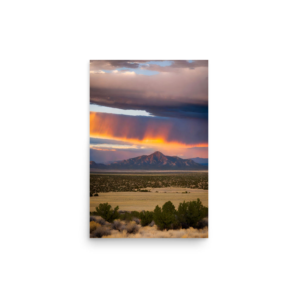 Vivid orange and red sunset hues illuminated rugged peaks. Foreground shrubs anchored picturesque landscape scene. Dramatic skies ablazed.