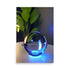 A modern art glass sphere reflecting neon blue light, on art prints.