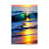  A colorful ocean sunset painting with the sun shining through the waves.