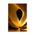 An abstract art sculpture shines brightly, the warm glow of the gold makes