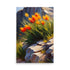 Orange flowers with a fiery colored bloom against a rugged cliff backdrop.