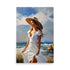 A sunbathed woman in a beautiful white dress and hat, that is standing by the sea.