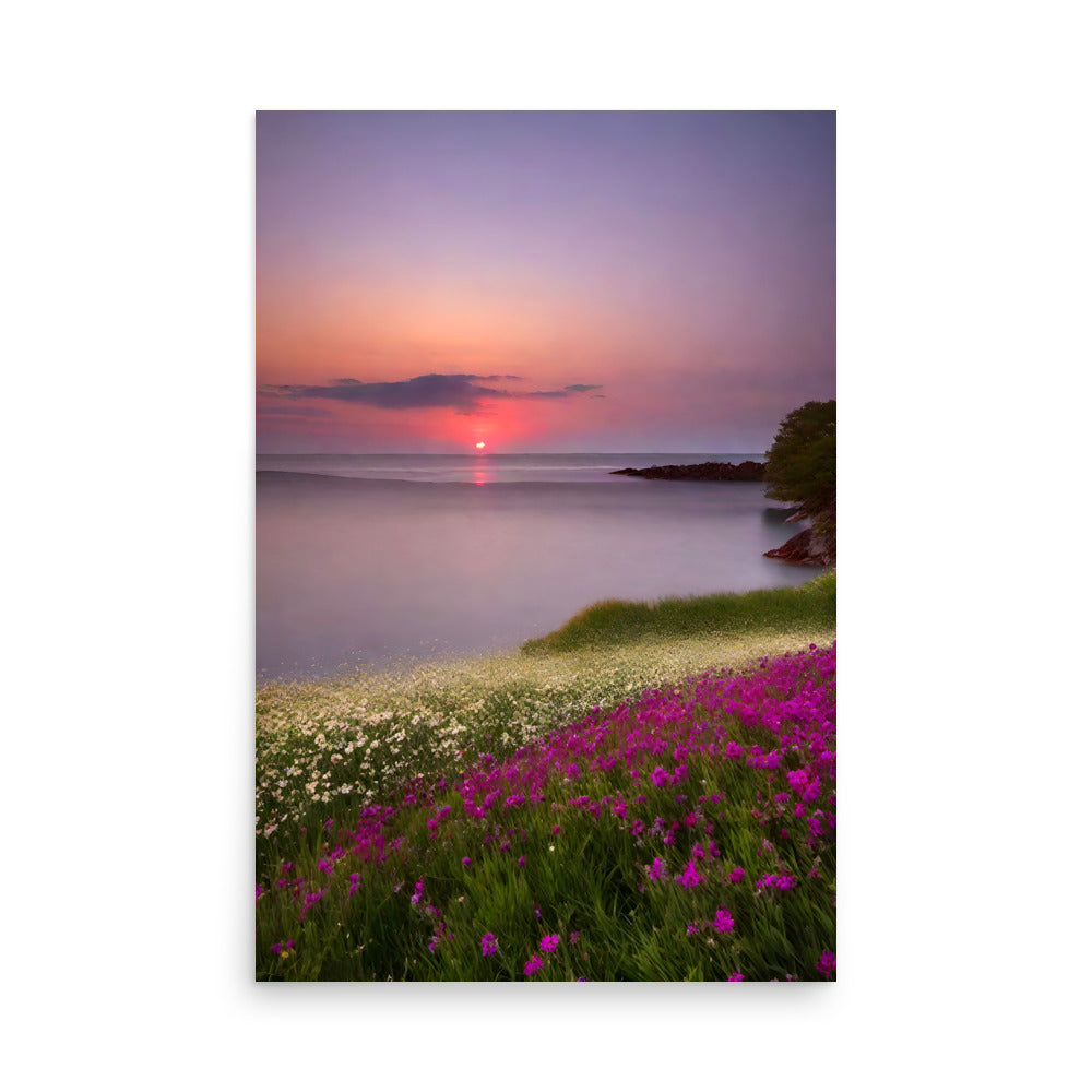 A sunset over a tranquil sea with pink and white flowers under light purple glowing clouds.