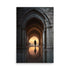 Magnificent arched walkway greets visitors. Intricate stonework forms vaulted arches radiating warmth. Solitary figure silhouetted against golden sunset. Reflective puddle mirrors arches above symmetrically. Atmospheric warm tones contrast cool grays.